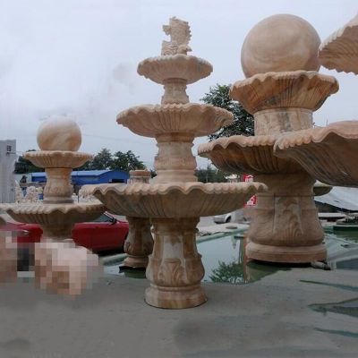 风水球喷泉，晚霞红石雕鱼喷泉