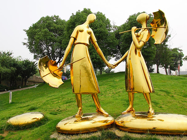 拿雨伞的人物雕塑不锈钢镜面人物雕塑_wps图片